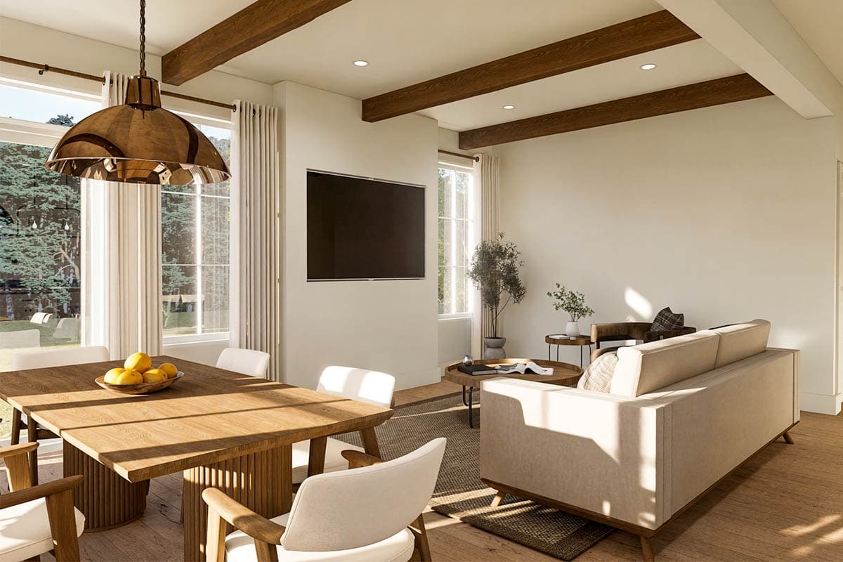 Living and dining area with wooden beams on ceiling, large windows, modern furniture, and a wall-mounted TV.