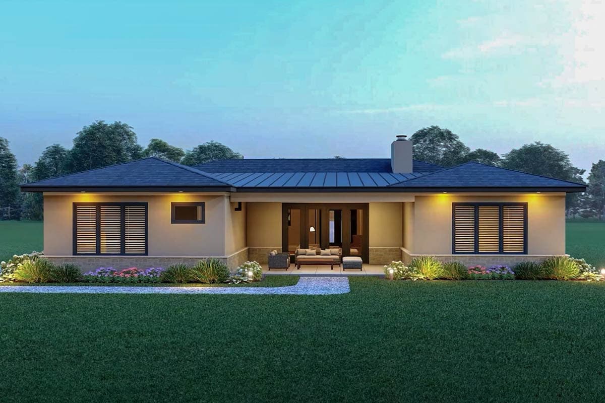 House plan exterior: One-story home with a low-pitched hip roof, central covered patio with double doors, and large louvered windows.