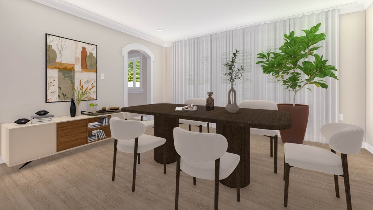 Dining room with dark wood table, cream chairs, buffet, arched doorway, and sheer curtains.