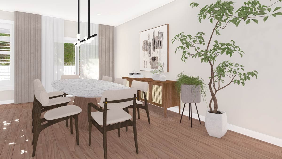 Dining room with oval marble table, chairs, credenza, abstract art, large plant and windows with curtains.