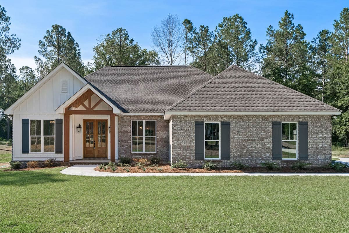 One-story house plan exterior with brick and white siding, covered entry with wood beams, and dark shutters.