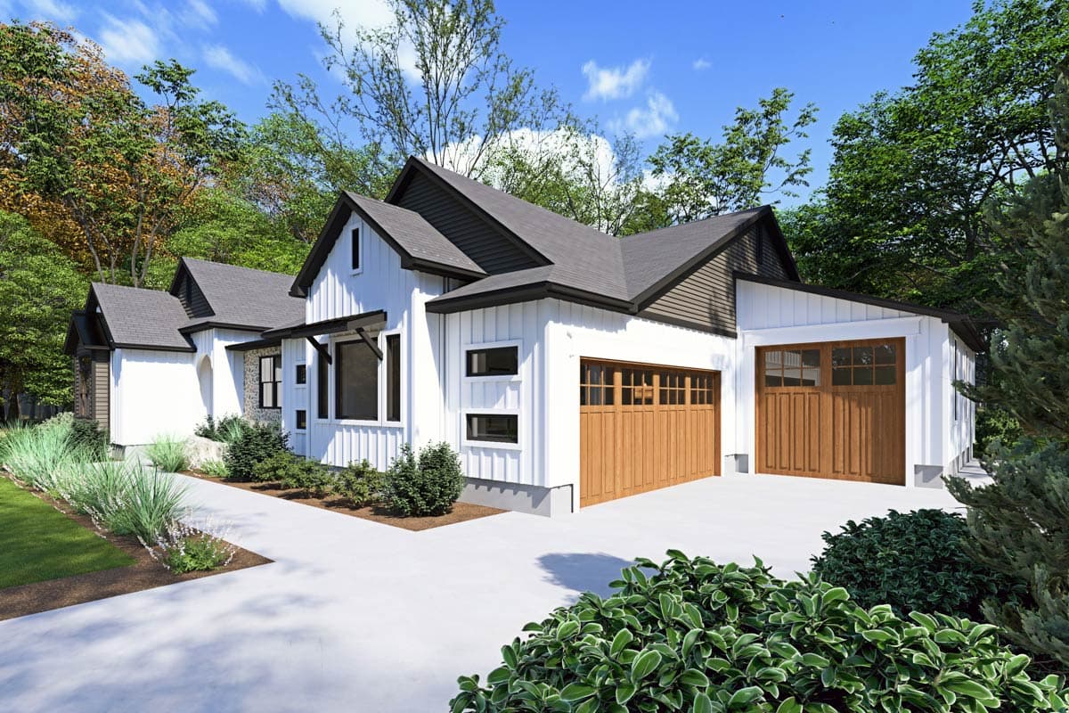 House plan exterior: Modern Farmhouse style with white board-and-batten siding, dark gable roof, and wood garage doors.