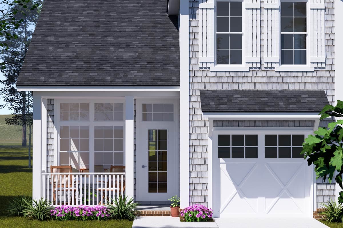 House plan exterior featuring a covered porch, shingle siding, multiple gables, and a two-car garage.