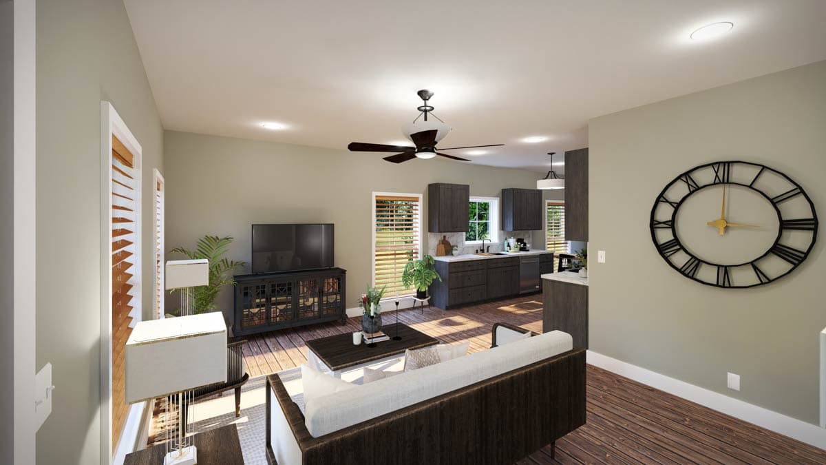 Open concept living room and kitchen with dark wood cabinets, island, seating area, and television.
