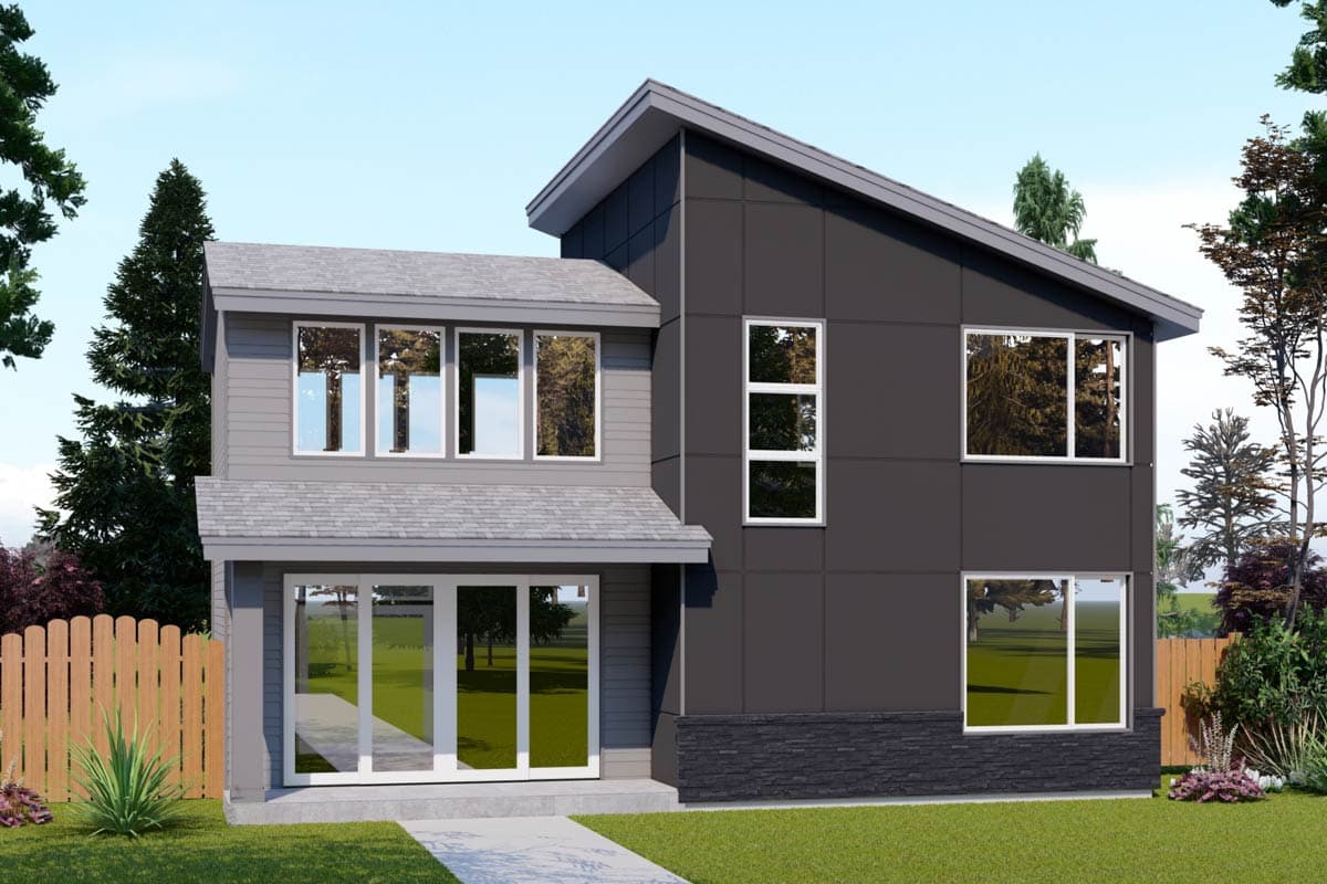 A modern two-story house with gray siding and dark accents, featuring large windows and a sloped roof. Landscaping surrounds the home.