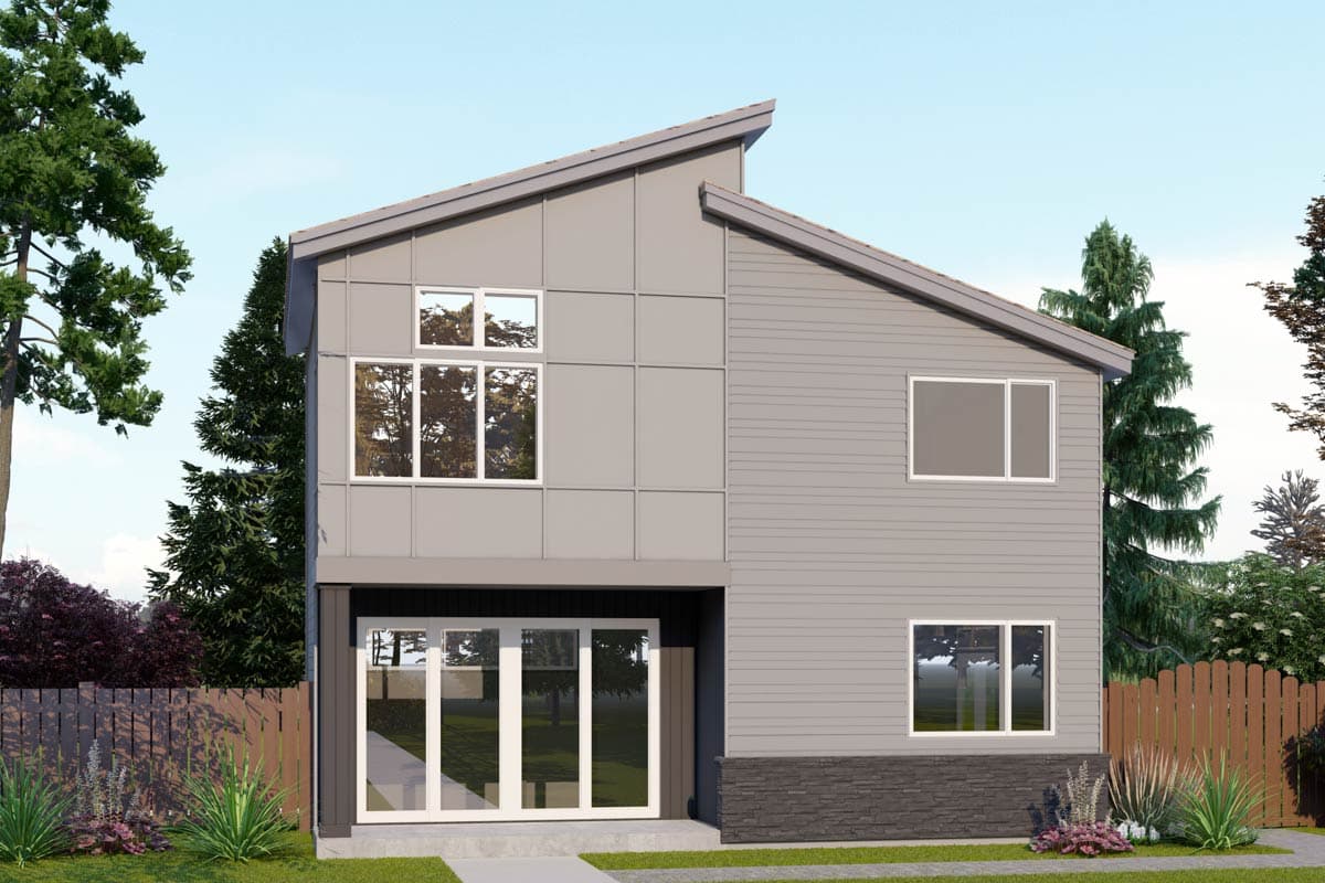 A modern two-story house with a gray exterior. Large windows and glass doors allow natural light to fill the home. Tall trees frame the house.