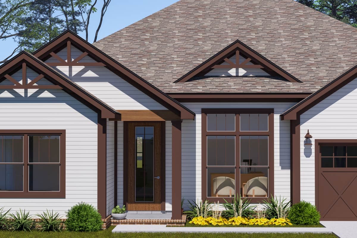House plan exterior showing a one-story home with gabled dormers, decorative truss details, a covered entry, and a garage.