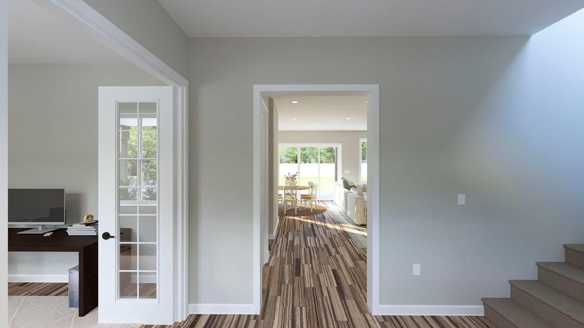 Interior view of house plan showing a home office, dining area, and living room with a skylight and staircase.