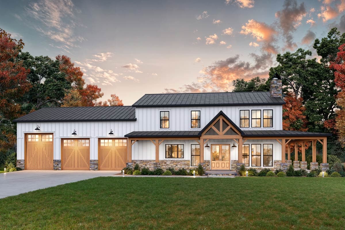Modern Farmhouse house plan exterior with a metal roof, wide porch, stone base, and a three-car garage.
