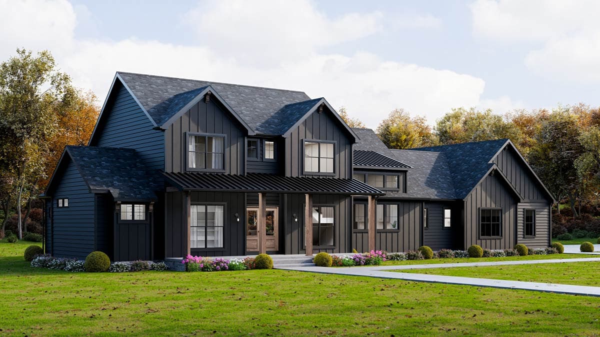 A modern, two-story farmhouse-style house with black siding and a dark roof. It has a covered porch, set on a green lawn with trees.