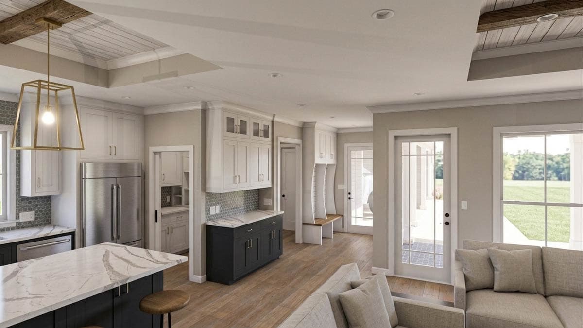 Open-concept living area with kitchen island, shaker cabinets, stainless steel appliances, and a built-in bench.