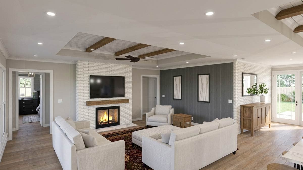 Interior rendering of a living room with a white brick fireplace, wood-beamed ceiling, and adjacent bedroom entrance.