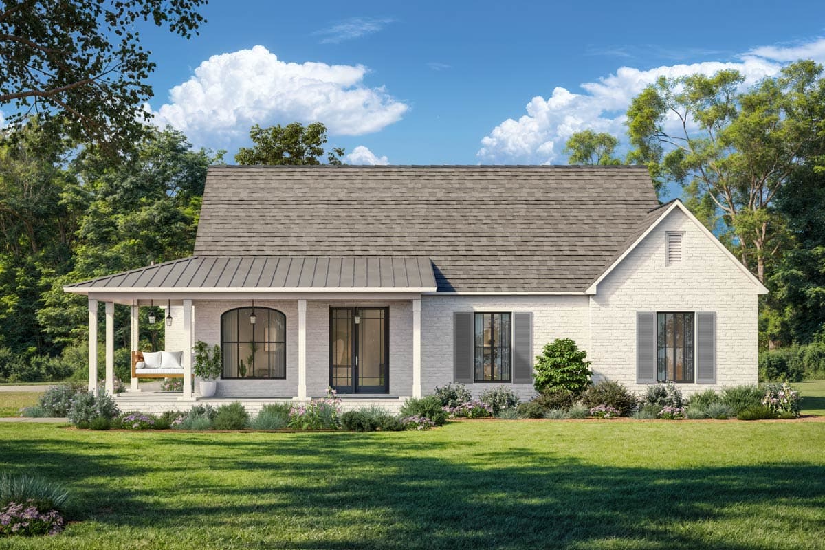 A charming white brick house with a gray roof and porch swing. Lush green lawn and trees surround the exterior, under a bright blue sky.