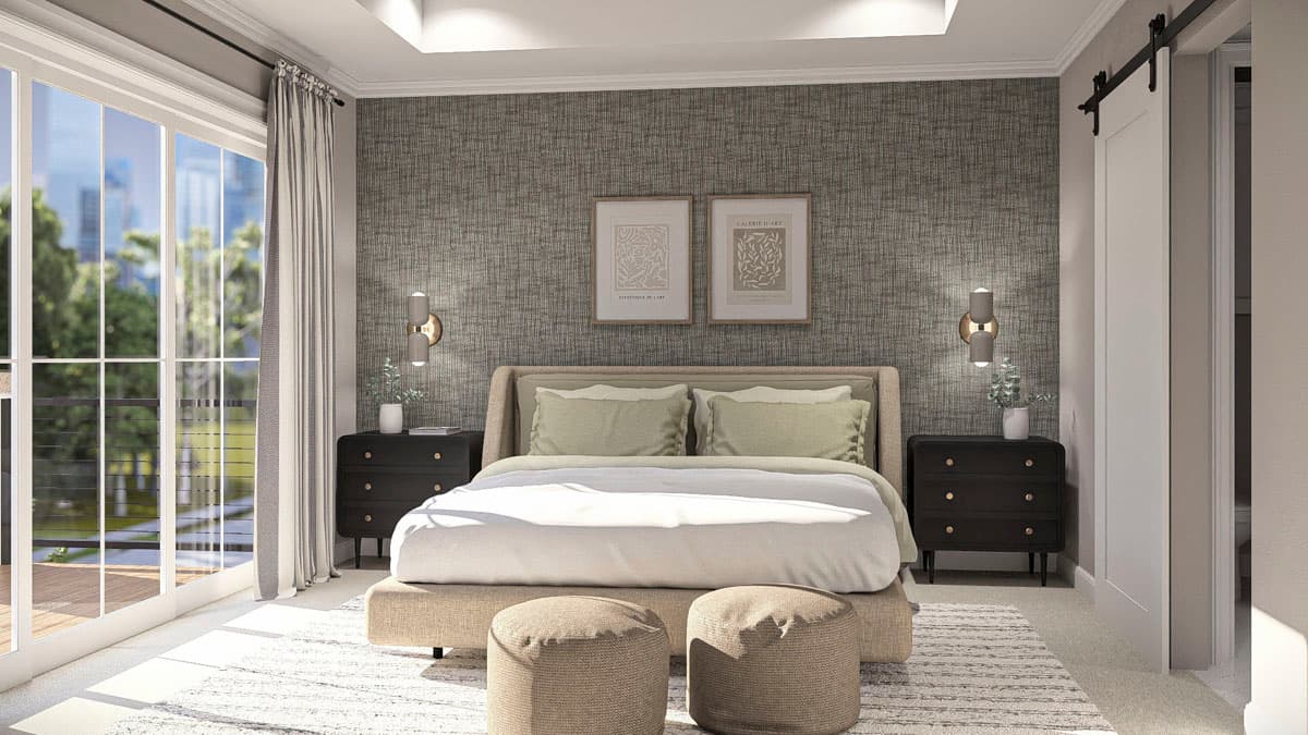Primary bedroom with king bed, textured accent wall, large windows with balcony access, and sliding barn door.