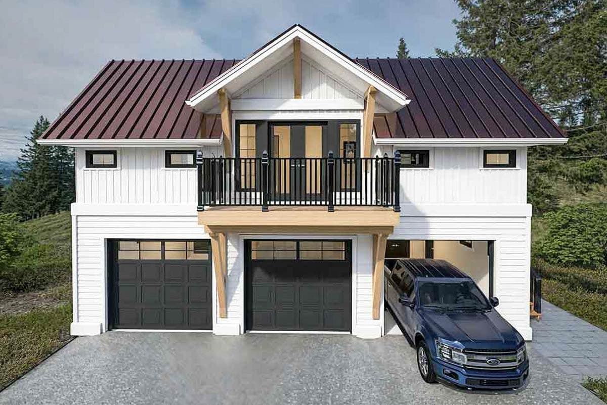 Two-story Modern Farmhouse exterior with a metal roof, balcony with black railing, and a three-car garage. A vehicle is parked in one bay.