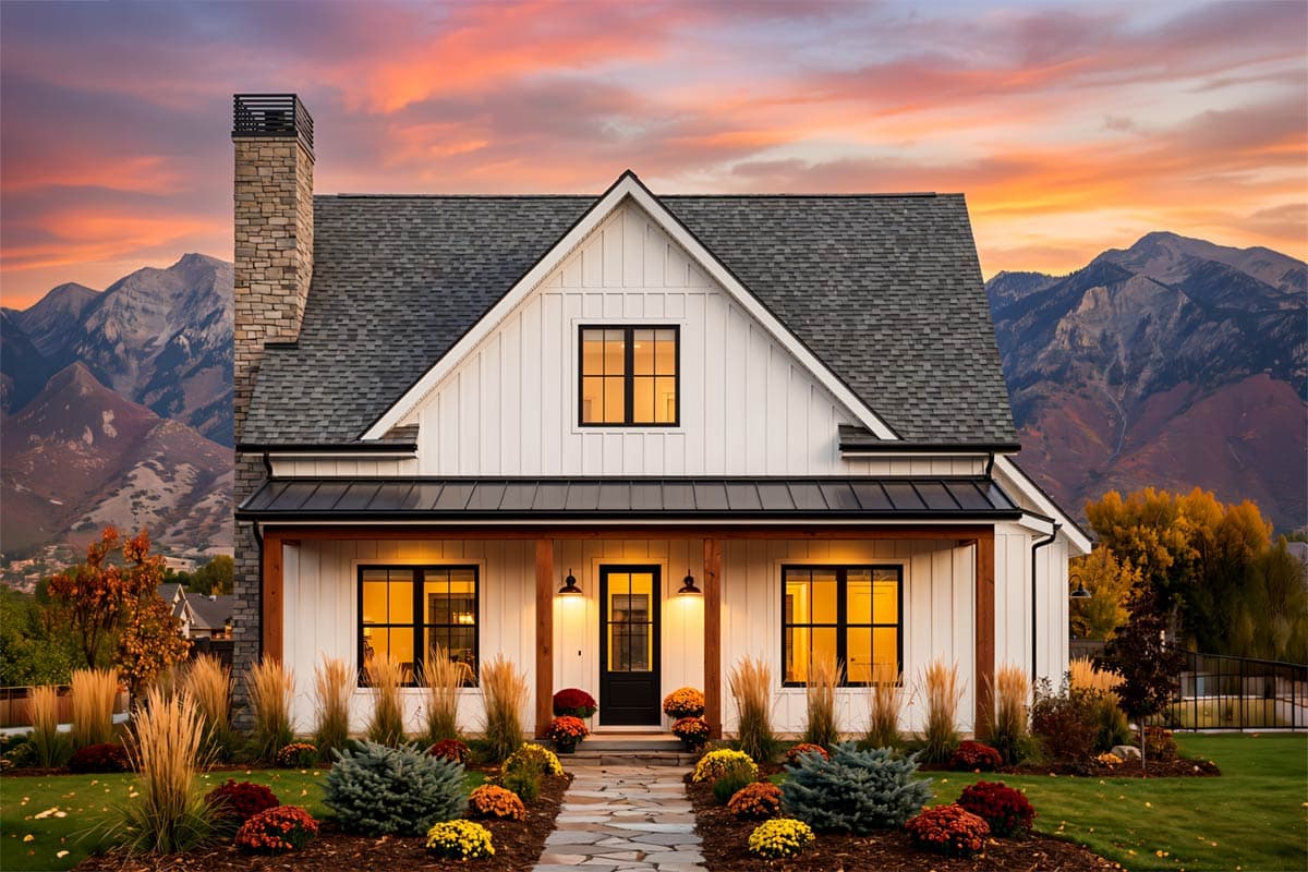 Modern Farmhouse style house plan exterior with gabled dormer, covered porch, and stone chimney.