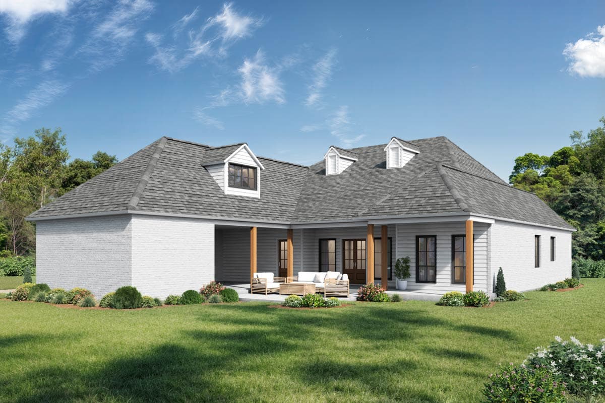 House plan exterior view of a single-story home with dormers, a covered patio, and white brick accents.