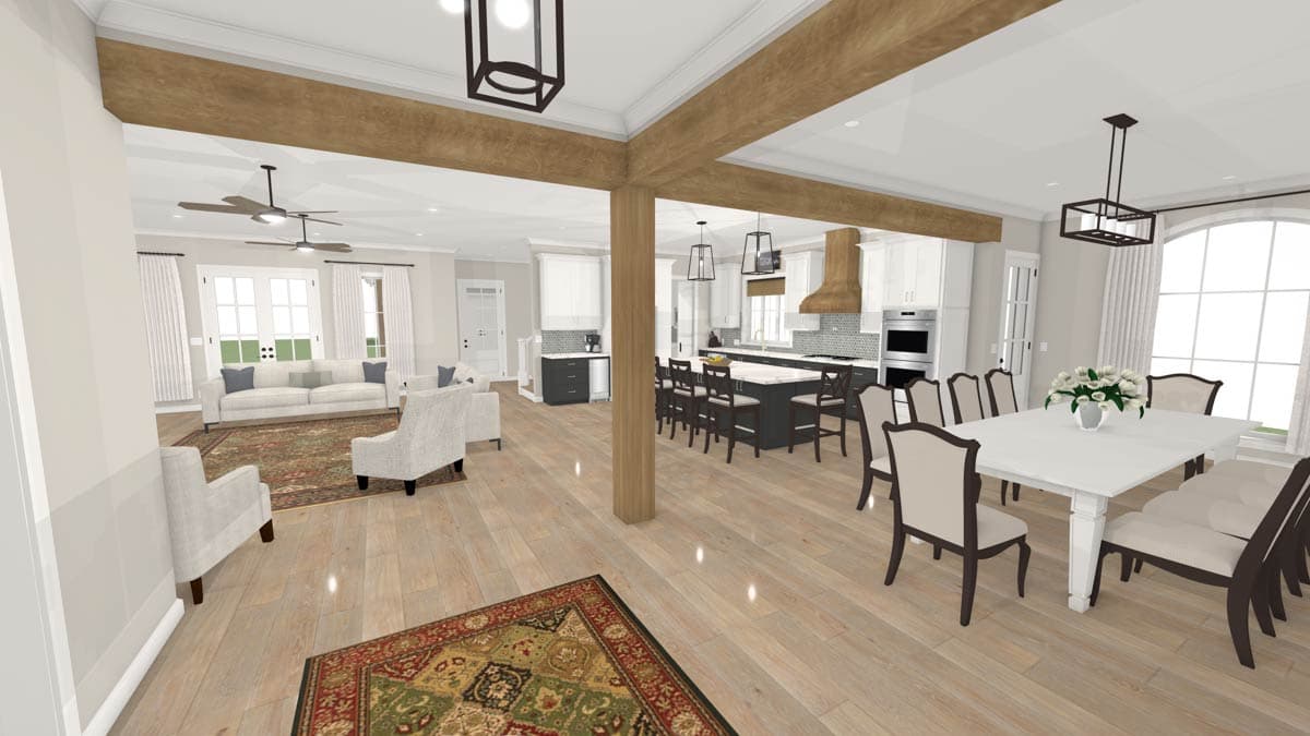 Open concept living space showing a great room with fireplace, dining area, and kitchen with island.