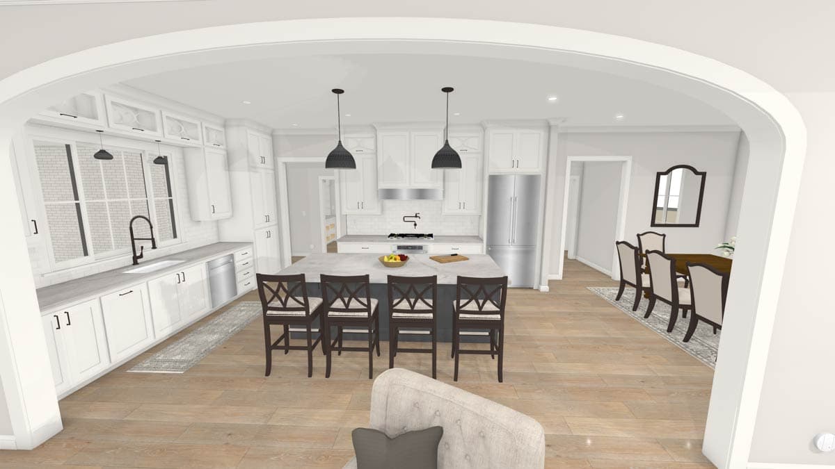 A spacious, open-concept kitchen and dining area with a large island, stools, and pendant lights. Light wood floors throughout.