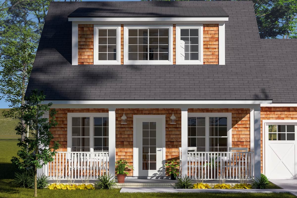 House plan exterior: Dormer with three windows above a covered porch with white railing and cedar shingles.