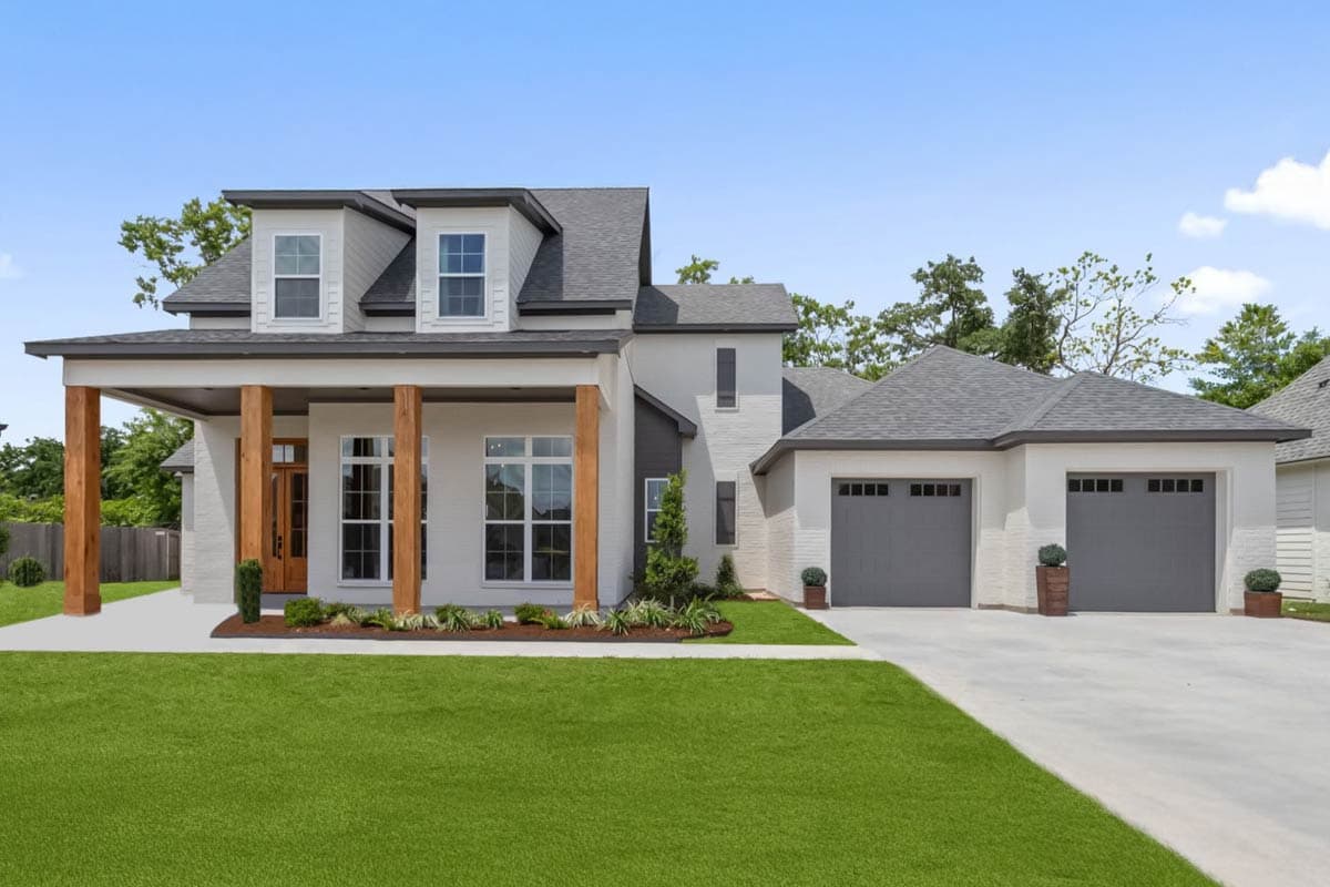 House plan exterior with two stories, Craftsman style. Features include a covered porch with timber columns, dormers, and a detached two-car garage.