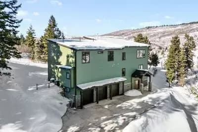 Expansive 5-Bedroom Mountain House Plan with Elevator and Two-Story Great Room