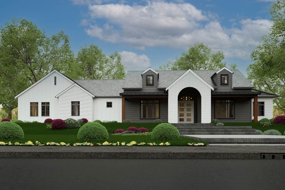 House plan exterior. Two-story Modern Farmhouse with gables, dormers, and an arched entry. Features include a brick facade and dark siding.