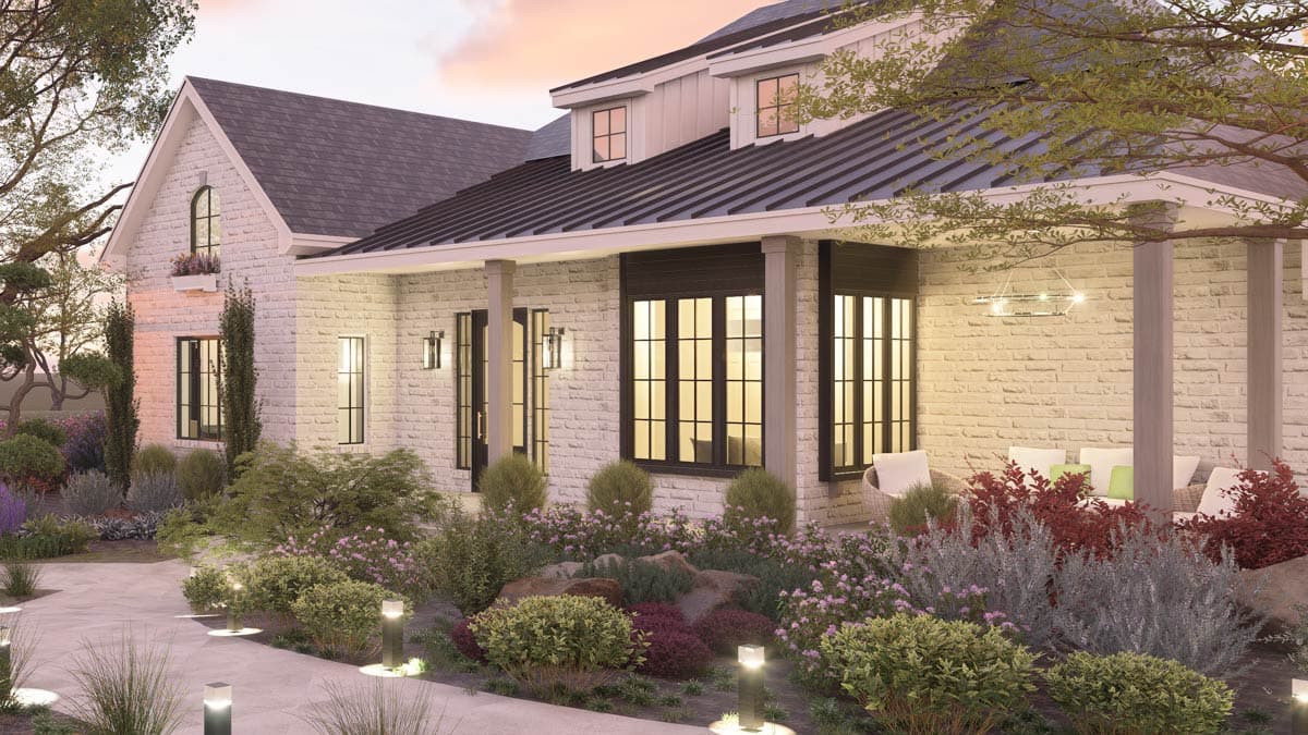 House plan exterior featuring white brick, a metal roof, gables, dormers, and a covered porch with columns.