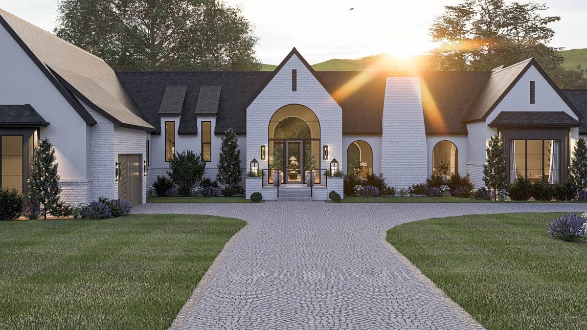 House plan exterior: Modern Farmhouse style, one story, featuring a prominent arched entryway, large gabled dormers, and a detached garage.