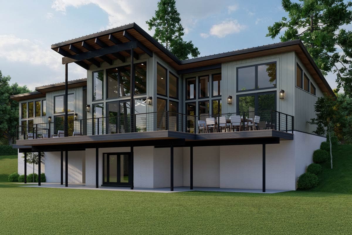 Modern house plan exterior with large windows, sloped rooflines, and wraparound deck.