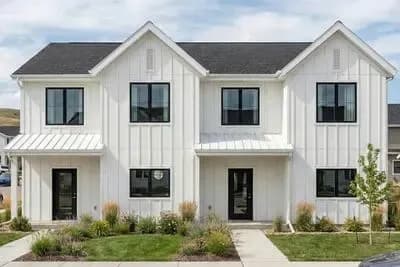 Modern Farmhouse 8-Bedroom Duplex Plan with Expansive Great Rooms