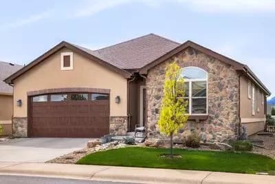 Rustic Craftsman Plan with Split Bedrooms and Covered Patio