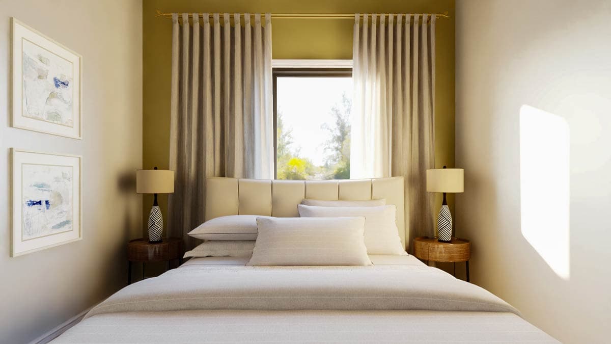 Cozy bedroom with a bed centered between two nightstands, each with a lamp. Soft curtains frame a window overlooking a bright outdoor scene.