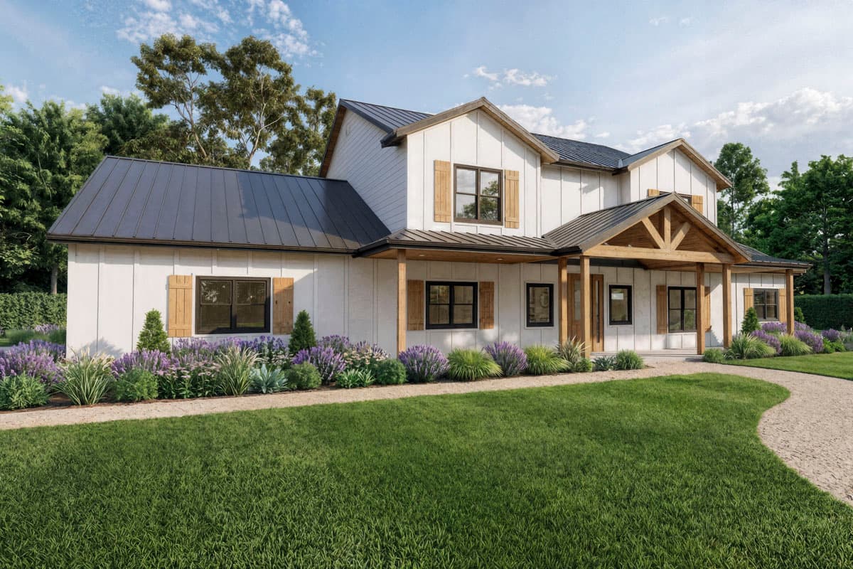 A two-story farmhouse with white siding, dark gray roof, and wooden accents. Landscaping includes lavender and a winding path leading to the porch.