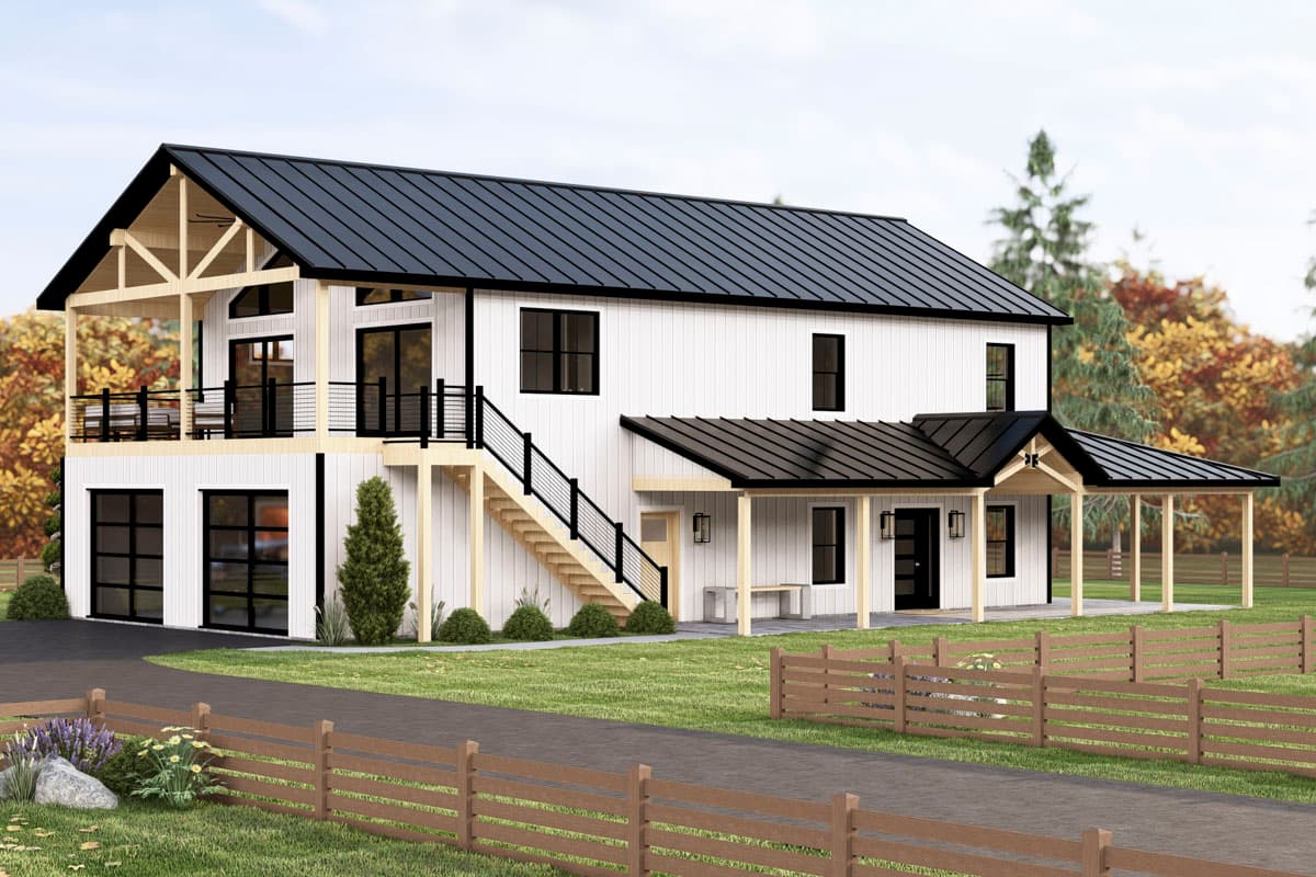 Modern farmhouse with white siding, black roof and trim, and a porch. A wooden fence surrounds the yard with autumn trees in the background.