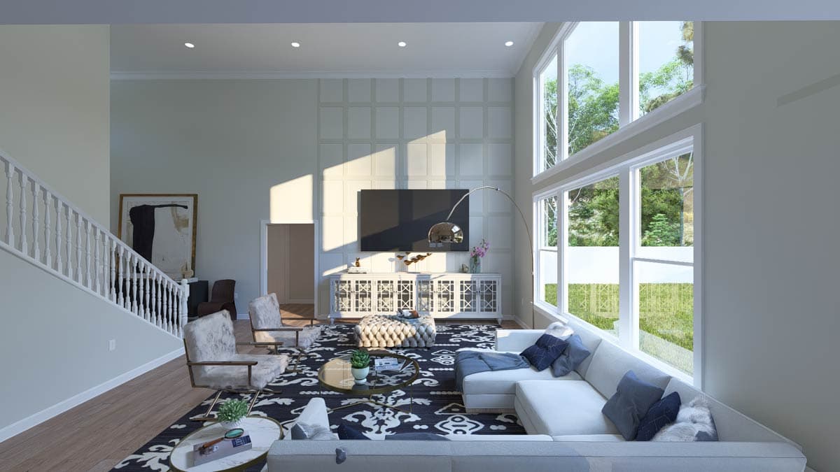 Interior rendering of a great room with vaulted ceiling, large windows, and a staircase. Features a media console and sectional.