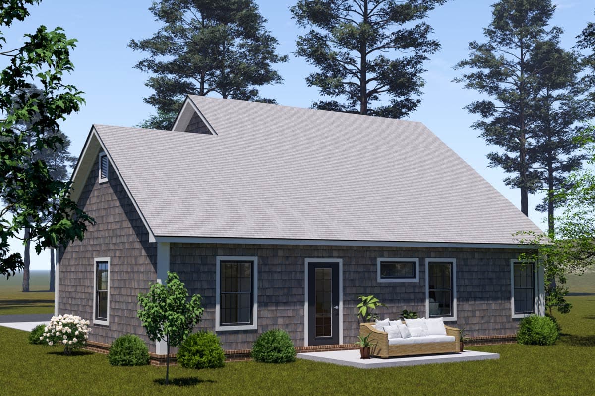House plan exterior featuring shake siding, prominent gables, and a rear patio with outdoor seating.