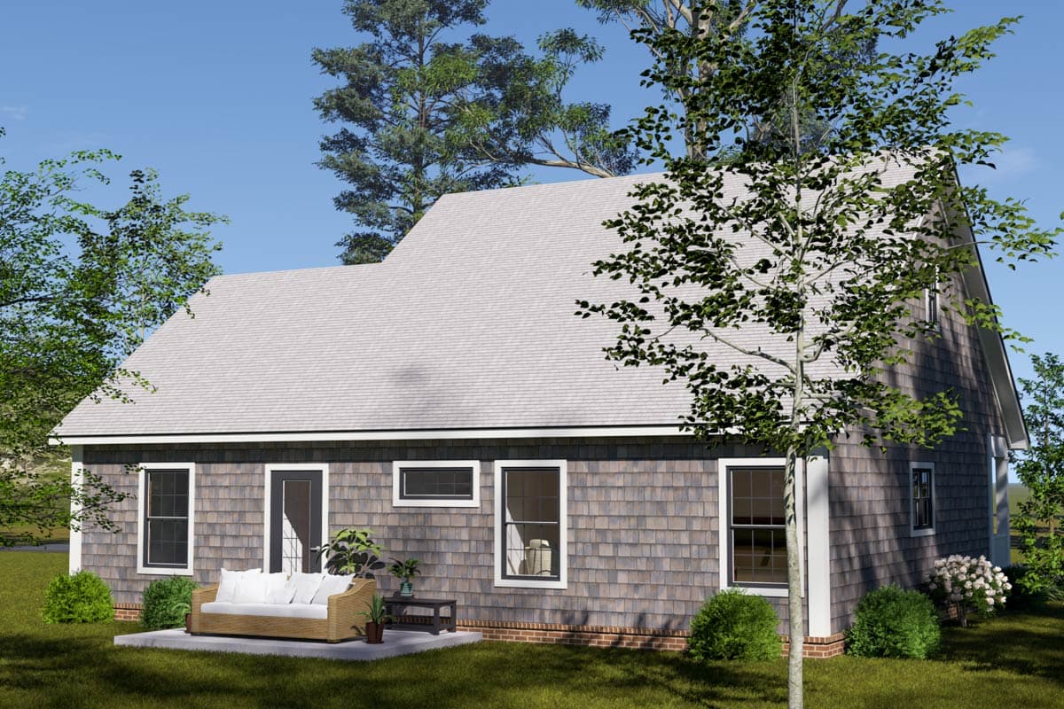 House plan exterior featuring cedar shingles, multiple gables, and a prominent dormer.