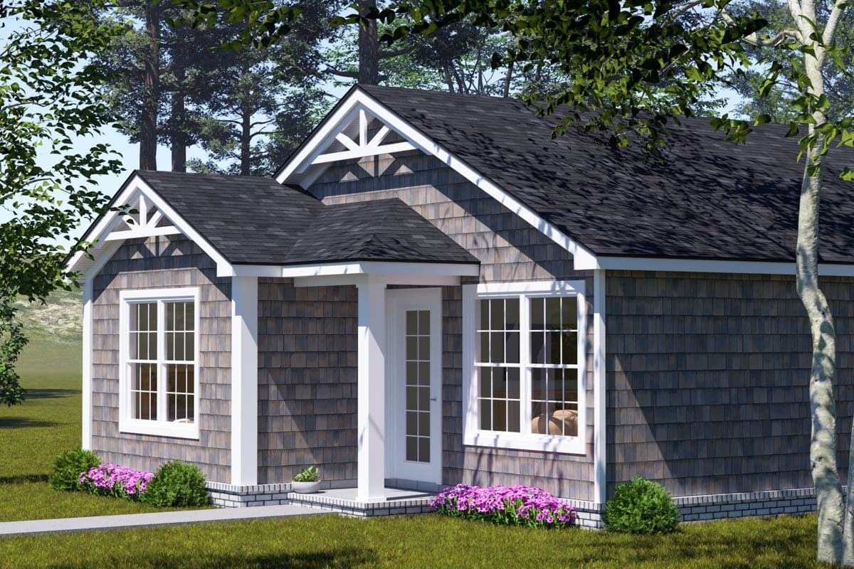 House plan exterior: Cottage style, single story, with decorative gables, shake siding, and a covered front entry.
