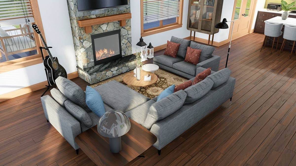 Living room with sectional sofa, stone fireplace with wood mantel, round coffee table, and wood floors.