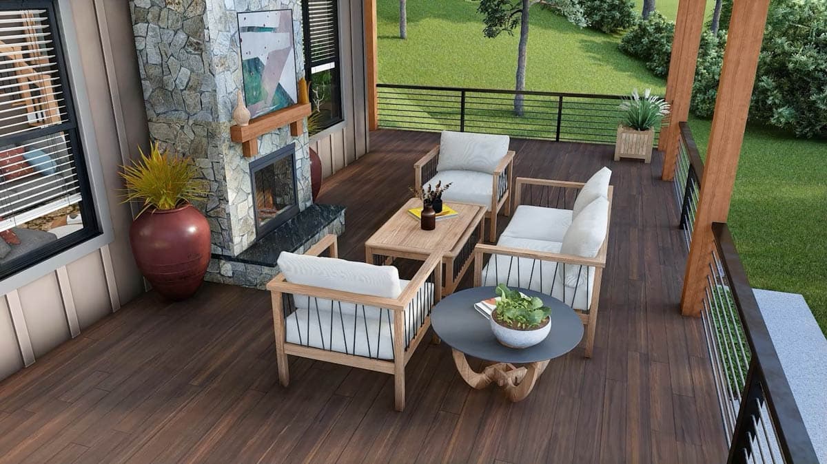 Deck with stone fireplace, seating area, and wood posts.