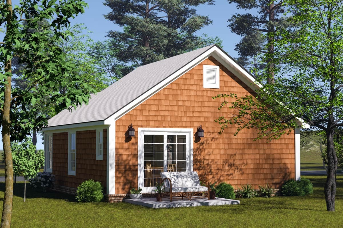 Cottage house plan exterior with cedar shakes, gable vent, and covered entry with double doors.
