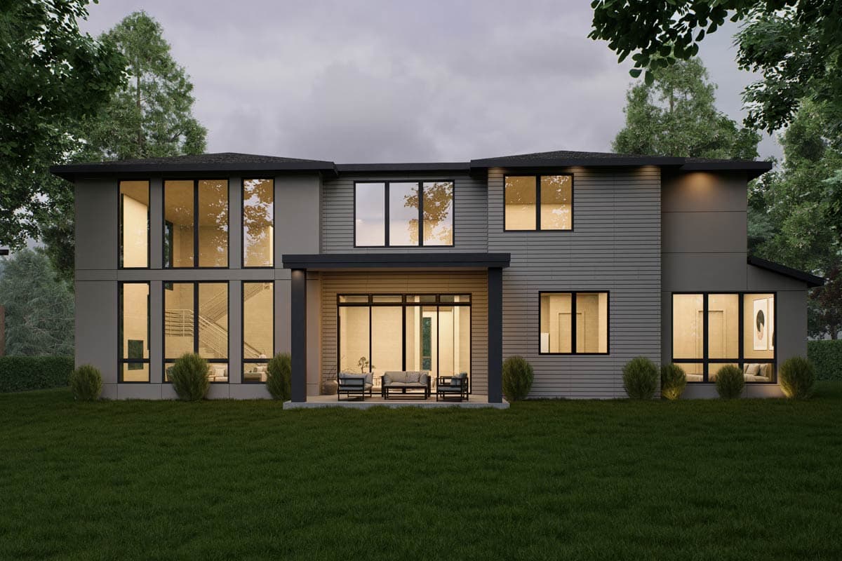 Two-story modern house plan exterior with large windows, flat roof, covered patio with seating, and mixed siding.