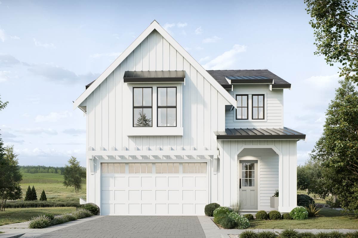 A modern, white farmhouse with black trim, a two-car garage, and a welcoming front porch. Lush greenery surrounds the house against a blue sky.