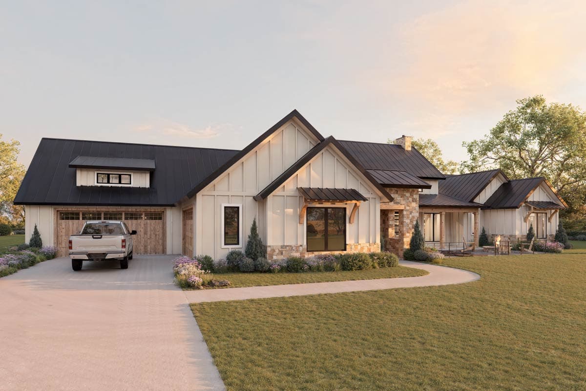 Modern Farmhouse house plan exterior with a metal roof, gabled dormers, stone accents, and a three-car garage.