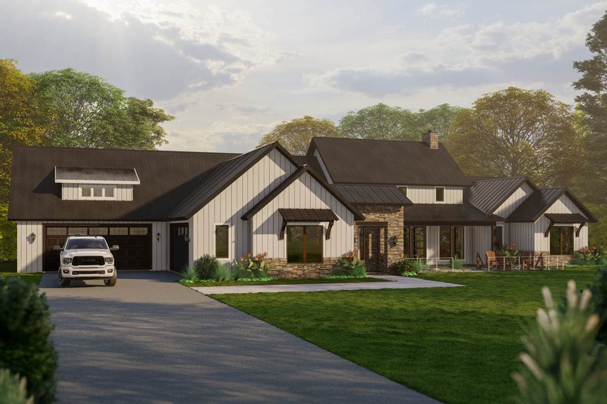 Modern Farmhouse house plan exterior with a metal roof, gabled dormers, stone accents, and a three-car garage.