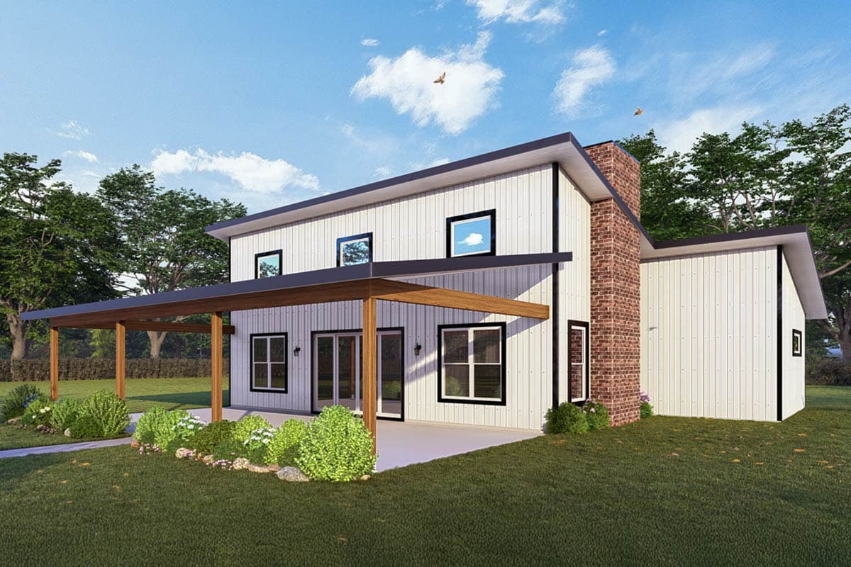 Modern two-story house with white siding, black trim, and a brick chimney. A covered patio with wooden supports extends from the house.