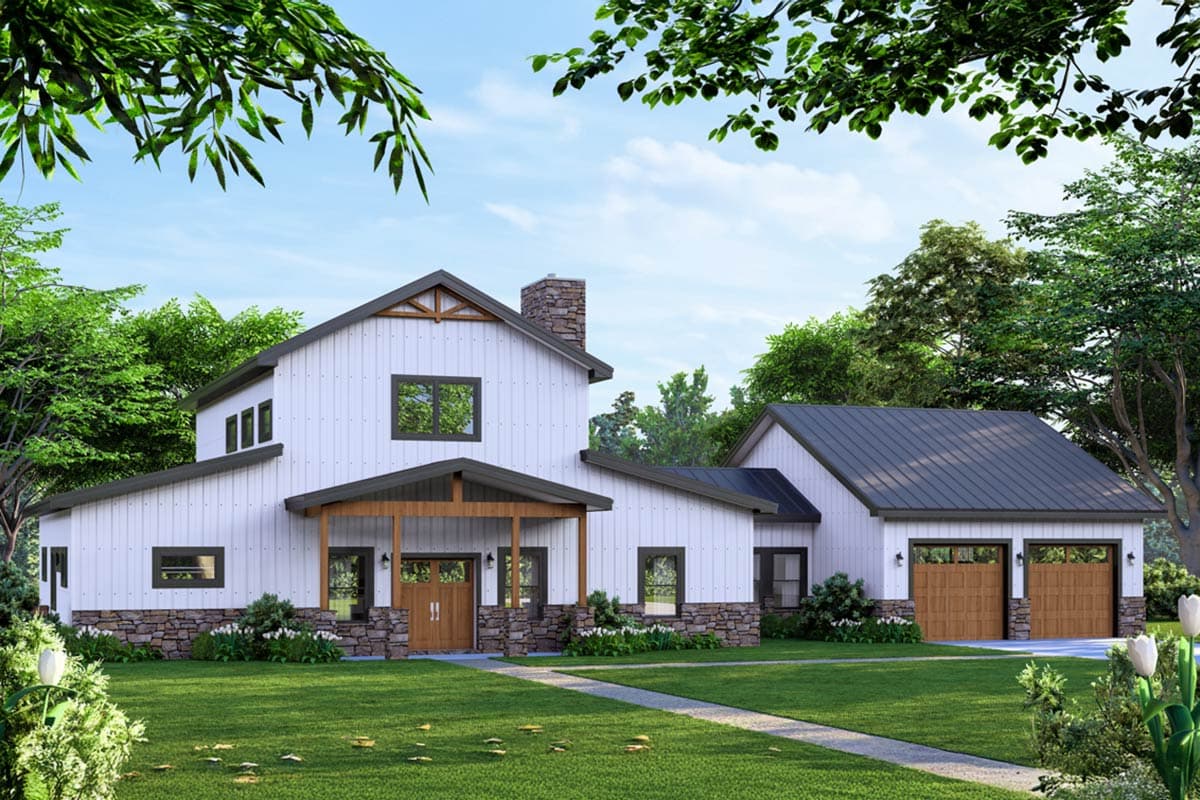 A modern farmhouse with white siding, stone accents, and a dark grey roof. A manicured lawn leads to the front door, with trees framing the house.