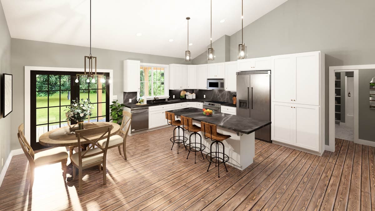 Modern kitchen with island, white cabinets, stainless steel appliances, and vaulted ceiling. Dining area with oval table. Open door to outdoors.