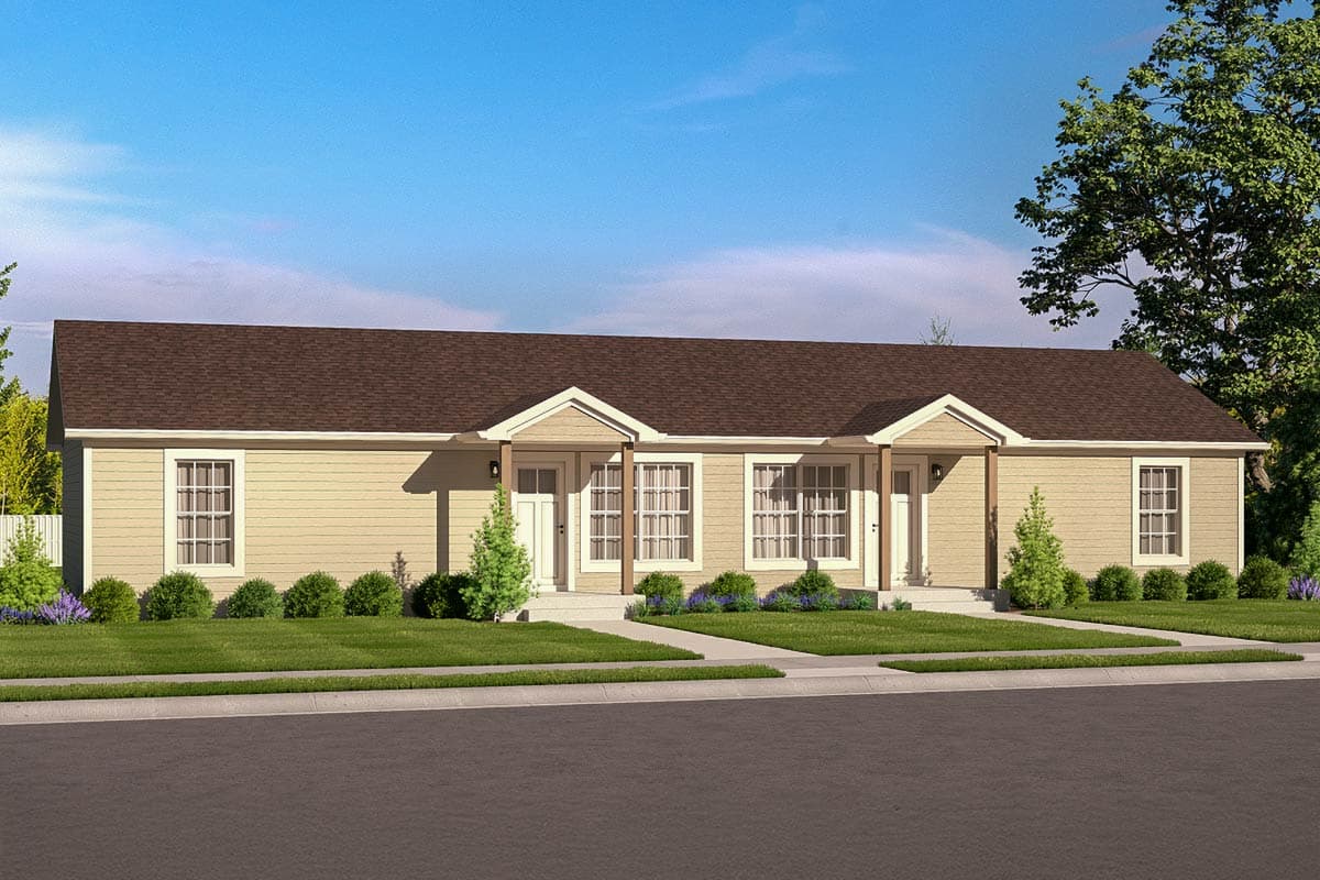 A beige duplex house with a brown roof and white trim. It features two front doors with small trees and bushes in front, on a green lawn.